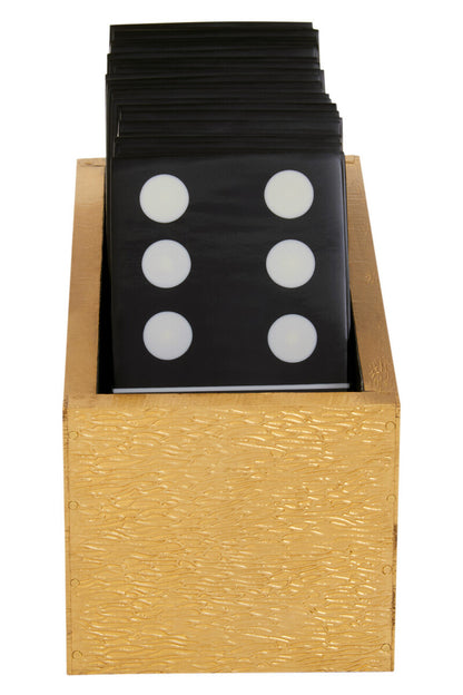 Set of dominoes with black tiles and white dots in a wooden holder on a white background