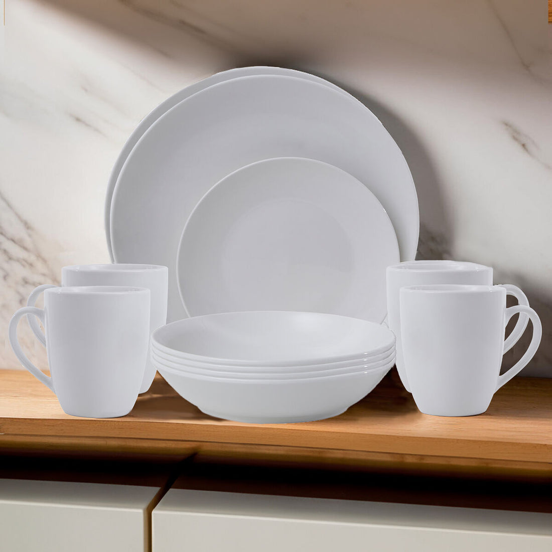 White ceramic dinnerware set on a wooden surface with a neutral background