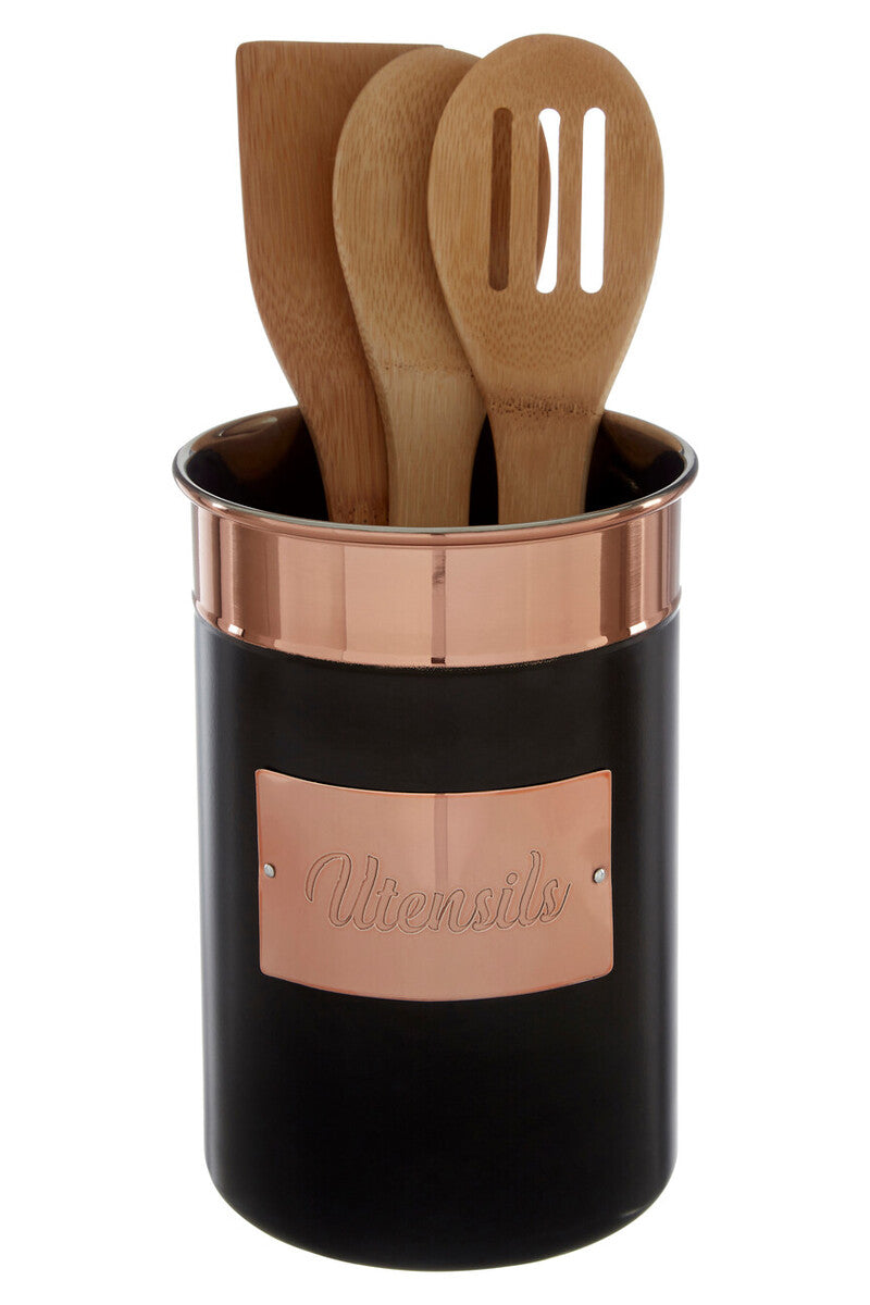 Black and rose gold utensil holder with wooden spoons on a white background