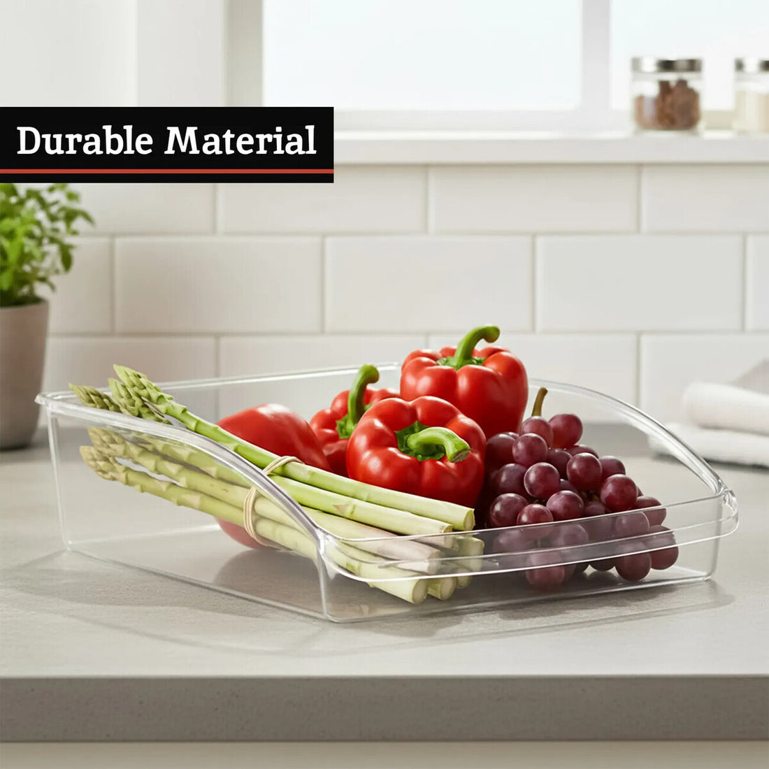 Clear plastic container with vegetables on a kitchen counter, labeled &