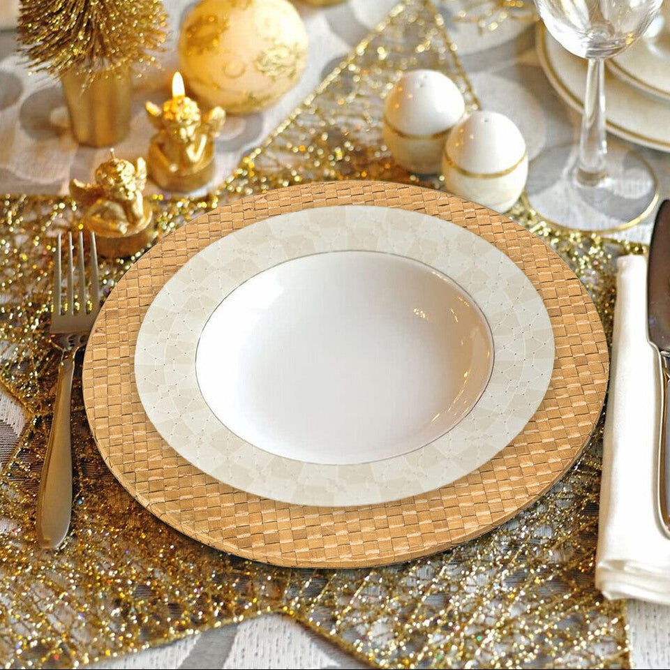 Decorative table setting with textured wood design elements on a gold and white tablecloth.