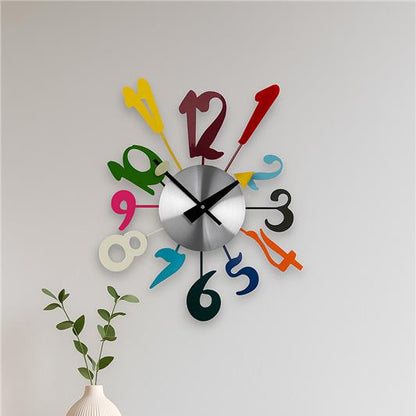 Colorful wall clock on a light gray wall with a wooden table and decorative items.