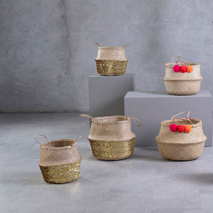 Set of woven baskets with fruits on a gray concrete floor and background